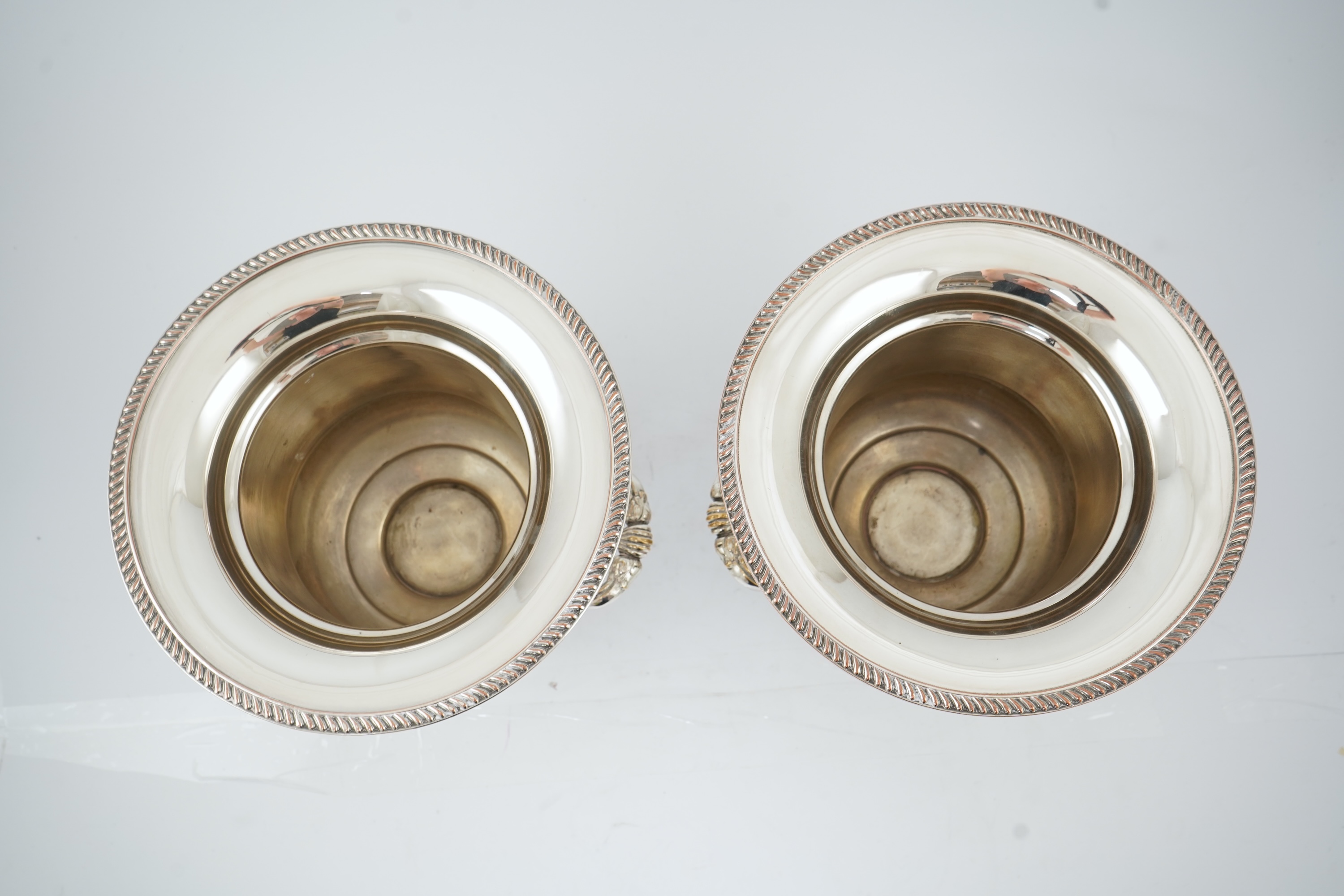 A pair of late 19th/early 20th century silver plated two handled campana shaped wine coolers, makers, FH